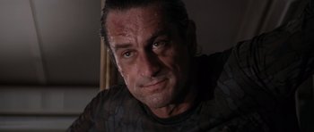 Movie still from “Cape Fear” (1991), directed by Martin Scorsese – A person wearing a black shirt; Close Up shot, Low angle