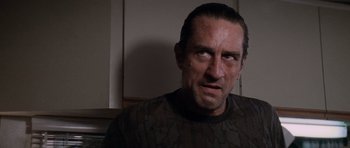 Movie still from “Cape Fear” (1991), directed by Martin Scorsese – A person in a room; Close Up shot, Low angle