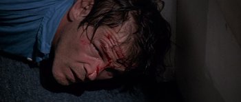 Movie still from “Cape Fear” (1991), directed by Martin Scorsese – A man with blood all over his face and head; Close Up shot, High angle