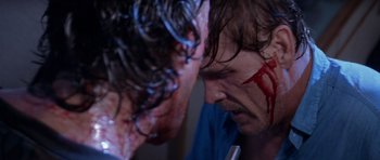 Movie still from “Cape Fear” (1991), directed by Martin Scorsese – A person with blood on their face; Close Up shot, Over the shoulder angle