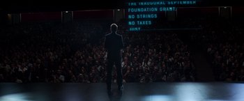 Movie still from “Captain America: Civil War” (2016), directed by Anthony Russo – A man standing in front of a crowd of onlookers; Extreme Wide shot, High angle