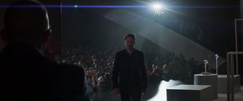 Movie still from “Captain America: Civil War” (2016), directed by Anthony Russo – A man walking down a runway in front of an audience; Wide shot, Low angle