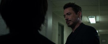 Movie still from “Captain America: Civil War” (2016), directed by Anthony Russo – A man standing in front of a mirror looking at himself in the mirror; Close Up shot, Over the shoulder angle