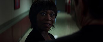 Movie still from “Captain America: Civil War” (2016), directed by Anthony Russo – A person with short hair; Close Up shot, Over the shoulder angle