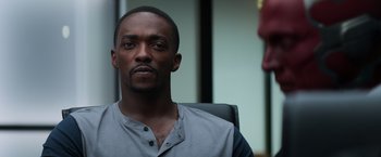 Movie still from “Captain America: Civil War” (2016), directed by Anthony Russo – A man sitting in an office chair looking into the distance; Close Up shot, Over the shoulder angle