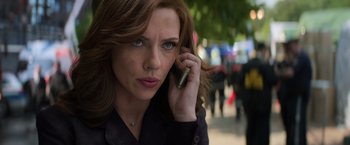 Movie still from “Captain America: Civil War” (2016), directed by Anthony Russo – A person talking on a cell phone; Close Up shot, Low angle