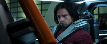 Movie still from “Captain America: Civil War” (2016), directed by Anthony Russo – A person with long black hair; Close Up shot, Over the shoulder angle