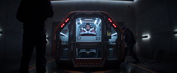 Movie still from “Captain America: Civil War” (2016), directed by Anthony Russo – A man sitting inside of a space ship; Wide shot, Low angle