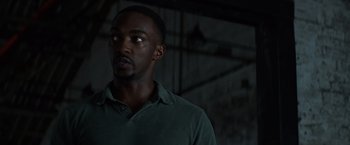 Movie still from “Captain America: Civil War” (2016), directed by Anthony Russo – A man standing in a dark room looking up at the ceiling; Close Up shot, Low angle