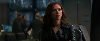 Movie still from “Captain America: Civil War” (2016), directed by Anthony Russo – A person wearing a leather jacket; Close Up shot, Over the shoulder angle