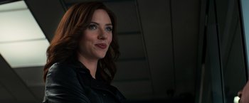 Movie still from “Captain America: Civil War” (2016), directed by Anthony Russo – A person wearing a leather jacket; Close Up shot, Over the shoulder angle