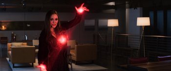 Movie still from “Captain America: Civil War” (2016), directed by Anthony Russo – A woman holding a red light in her hand; Medium shot, Over the shoulder angle