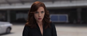 Movie still from “Captain America: Civil War” (2016), directed by Anthony Russo – A person with long hair; Close Up shot, Over the shoulder angle