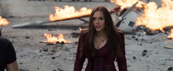 Movie still from “Captain America: Civil War” (2016), directed by Anthony Russo – A beautiful young woman in a red leather jacket; Medium shot, Over the shoulder angle