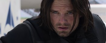 Movie still from “Captain America: Civil War” (2016), directed by Anthony Russo – A person with long hair; Close Up shot, Over the shoulder angle