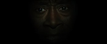 Movie still from “Captain America: Civil War” (2016), directed by Anthony Russo – A person's face in the dark; Extreme Close Up shot, High angle