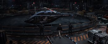 Movie still from “Captain America: Civil War” (2016), directed by Anthony Russo – Three men are standing in front of a black helicopter; Extreme Wide shot, High angle