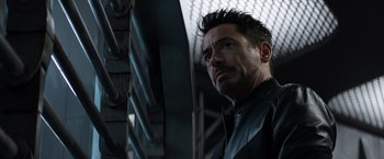 Movie still from “Captain America: Civil War” (2016), directed by Anthony Russo – A person wearing a black jacket; Close Up shot, Low angle