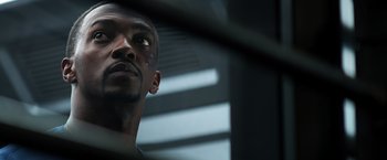 Movie still from “Captain America: Civil War” (2016), directed by Anthony Russo – A person looking at the camera; Close Up shot, Low angle