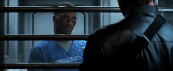 Movie still from “Captain America: Civil War” (2016), directed by Anthony Russo – A man in a jail cell looking at the camera; Close Up shot, Over the shoulder angle