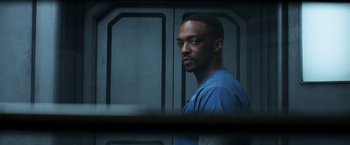 Movie still from “Captain America: Civil War” (2016), directed by Anthony Russo – A man standing in front of a door; Close Up shot, Over the shoulder angle