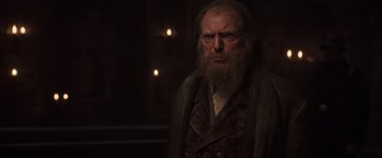 Movie still from “Captain America: The First Avenger” (2011), directed by Joe Johnston – An old man with a long beard wearing a suit; Close Up shot, Low angle