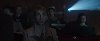 Movie still from “Captain America: The First Avenger” (2011), directed by Joe Johnston – A man and a woman sitting in front of each other; Medium shot, Low angle