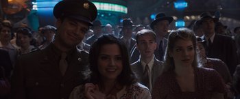 Movie still from “Captain America: The First Avenger” (2011), directed by Joe Johnston – A group of men and a woman standing next to each other; Medium shot, Over the shoulder angle