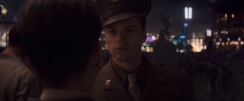 Movie still from “Captain America: The First Avenger” (2011), directed by Joe Johnston – A man in a military uniform looking into a mirror; Close Up shot, Over the shoulder angle