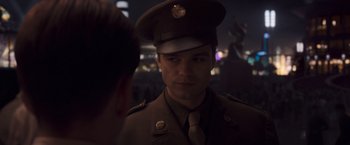 Movie still from “Captain America: The First Avenger” (2011), directed by Joe Johnston – A man in a military uniform is talking to a woman; Close Up shot, Over the shoulder angle