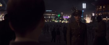 Movie still from “Captain America: The First Avenger” (2011), directed by Joe Johnston – A man in a military uniform standing in front of a crowd of onlookers; Medium shot, Over the shoulder angle