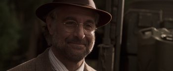Movie still from “Captain America: The First Avenger” (2011), directed by Joe Johnston – An older man wearing a brown hat and glasses; Close Up shot, Over the shoulder angle
