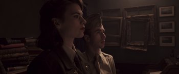 Movie still from “Captain America: The First Avenger” (2011), directed by Joe Johnston – A man and a woman in military uniforms looking at something; Close Up shot, Low angle