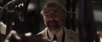 Movie still from “Captain America: The First Avenger” (2011), directed by Joe Johnston – An older man with a beard and glasses; Close Up shot, Over the shoulder angle