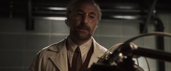 Movie still from “Captain America: The First Avenger” (2011), directed by Joe Johnston – An older man in a white shirt and tie looking at his reflection in a mirror; Close Up shot, Low angle