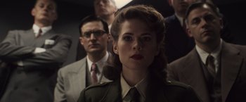 Movie still from “Captain America: The First Avenger” (2011), directed by Joe Johnston – A woman in a military uniform standing in front of a man; Close Up shot, Over the shoulder angle