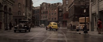 Movie still from “Captain America: The First Avenger” (2011), directed by Joe Johnston – An old car is driving down the street; Extreme Wide shot, High angle