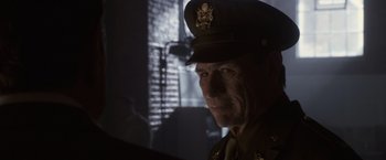 Movie still from “Captain America: The First Avenger” (2011), directed by Joe Johnston – A person wearing a uniform; Close Up shot, Over the shoulder angle