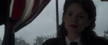 Movie still from “Captain America: The First Avenger” (2011), directed by Joe Johnston – A person wearing a suit and tie; Close Up shot, Over the shoulder angle