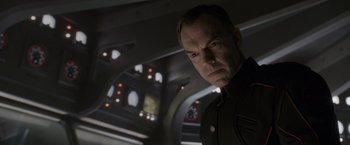 Movie still from “Captain America: The First Avenger” (2011), directed by Joe Johnston – A person wearing a suit and tie; Close Up shot, Low angle