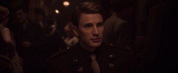 Movie still from “Captain America: The First Avenger” (2011), directed by Joe Johnston – A person wearing a military uniform; Close Up shot, Over the shoulder angle