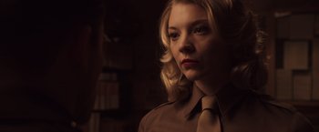 Movie still from “Captain America: The First Avenger” (2011), directed by Joe Johnston – A woman with blonde hair wearing a tie; Close Up shot, Over the shoulder angle