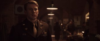 Movie still from “Captain America: The First Avenger” (2011), directed by Joe Johnston – A man in a military uniform standing in a hallway; Close Up shot, Over the shoulder angle