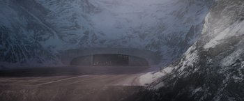 Movie still from “Captain America: The First Avenger” (2011), directed by Joe Johnston – A road going through a tunnel in the middle of the night; Extreme Wide shot, High angle