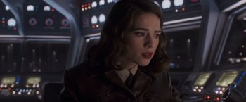 Movie still from “Captain America: The First Avenger” (2011), directed by Joe Johnston – A person wearing a leather jacket; Close Up shot, Over the shoulder angle