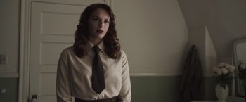 Movie still from “Captain America: The First Avenger” (2011), directed by Joe Johnston – A woman in a dress shirt and a tie; Medium shot, Over the shoulder angle
