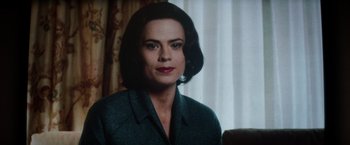 Movie still from “Captain America: The Winter Soldier” (2014), directed by Anthony Russo – A person with short hair wearing a suit; Close Up shot, Over the shoulder angle