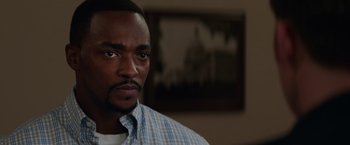 Movie still from “Captain America: The Winter Soldier” (2014), directed by Anthony Russo – A person wearing a plaid shirt; Close Up shot, Over the shoulder angle