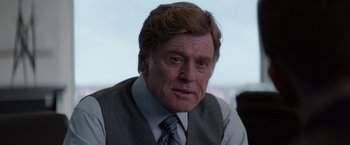 Movie still from “Captain America: The Winter Soldier” (2014), directed by Anthony Russo – An older man wearing a suit and tie; Close Up shot, Over the shoulder angle