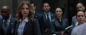 Movie still from “Captain America: The Winter Soldier” (2014), directed by Anthony Russo – A group of people in business suits standing next to each other; Close Up shot, Over the shoulder angle